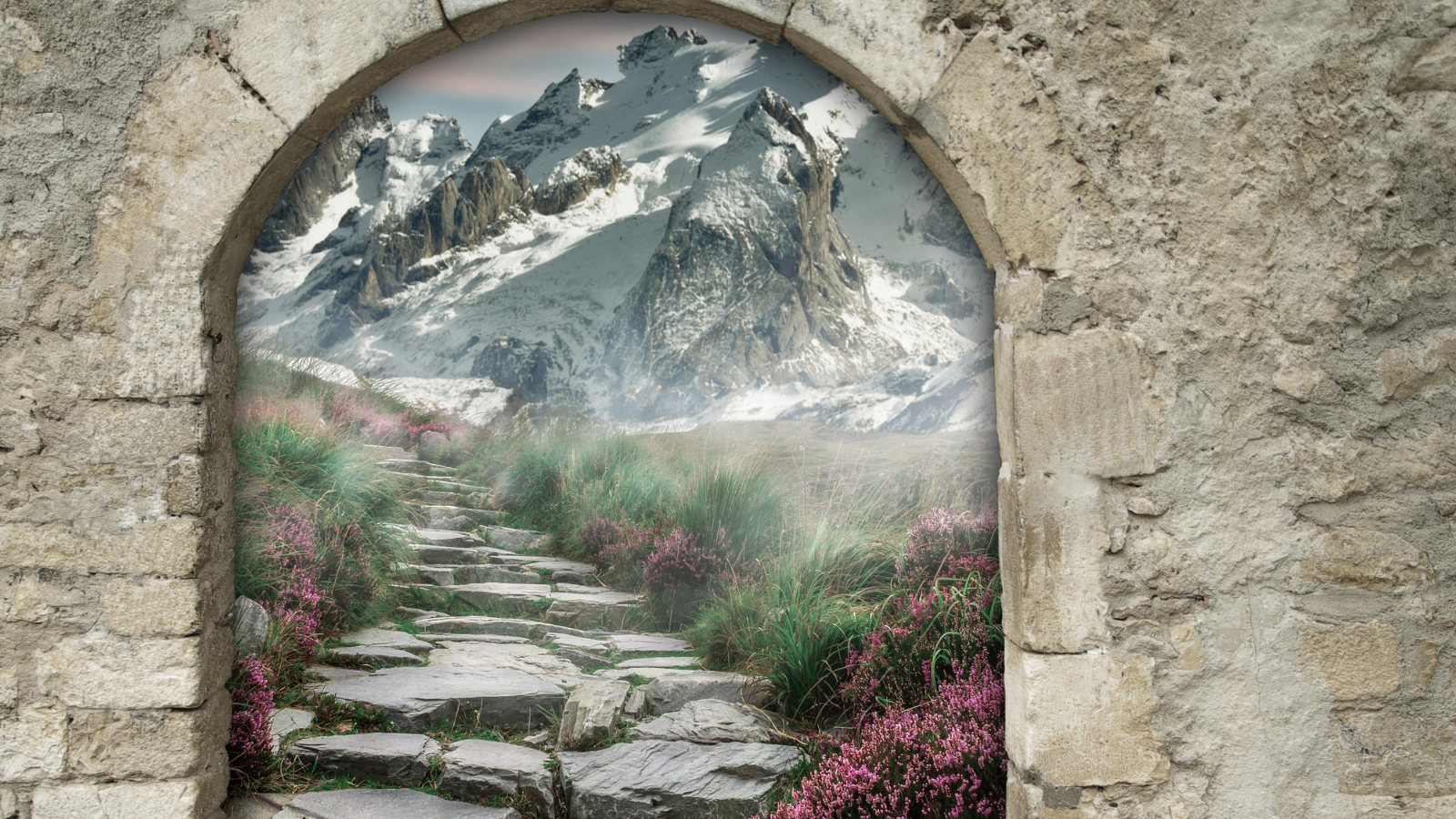 Medieval stone arch leading into misty mountains.