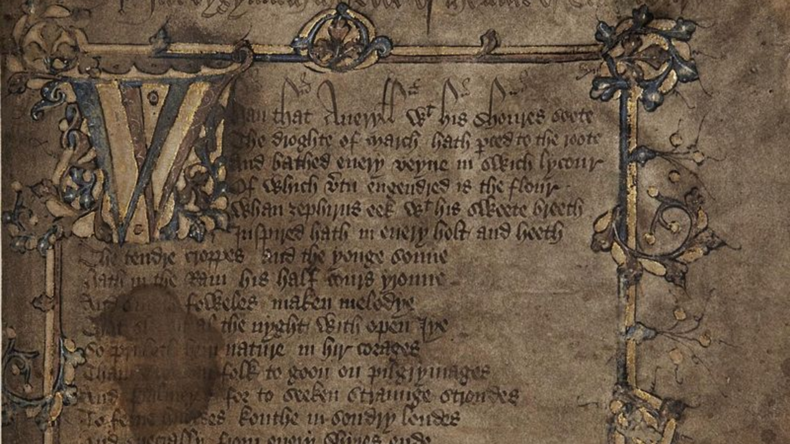 Close-up of the Canterbury Tales manuscript. It looks very old and is in pieces.