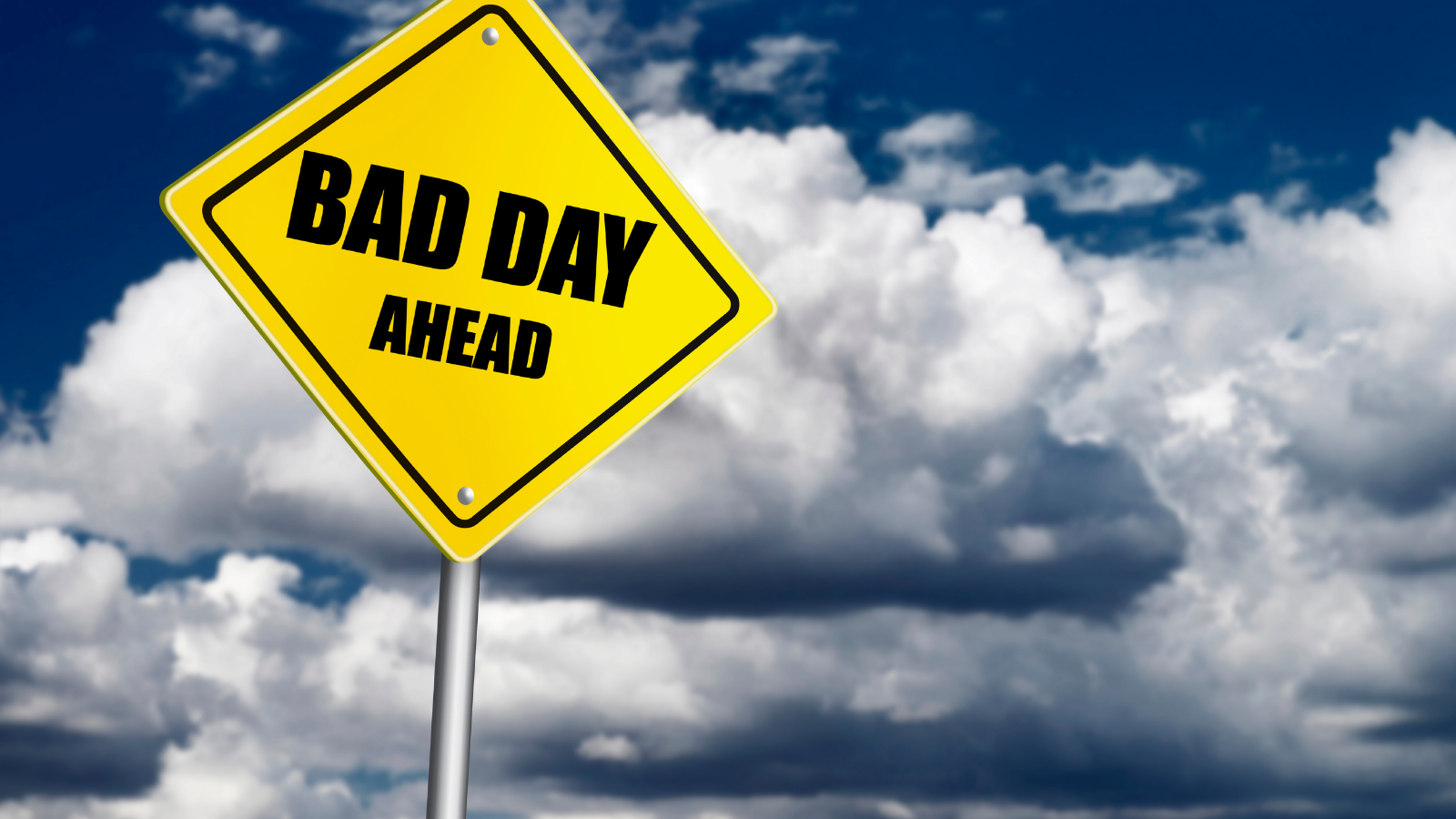 Signpost reading BAD DAY AHEAD.